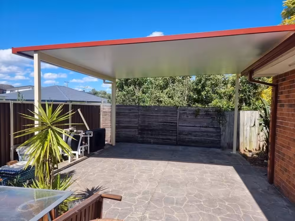 Backyard patio with roof and plants