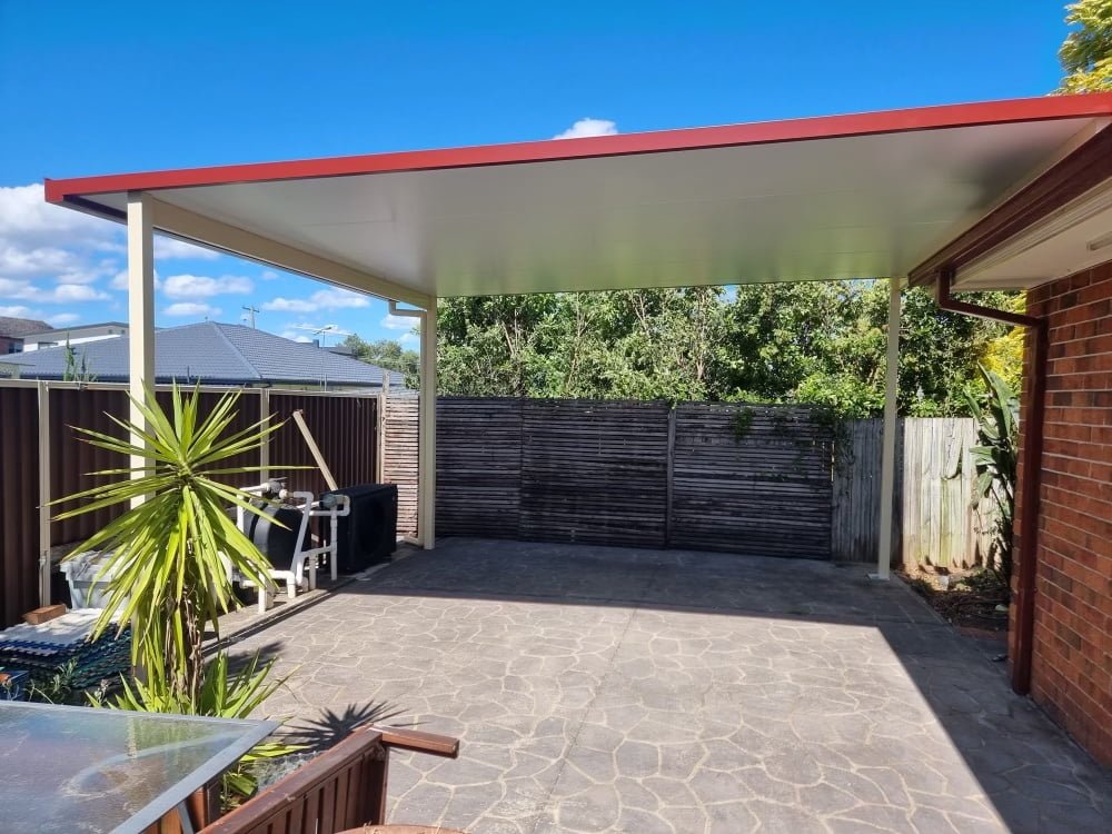 Backyard patio with roof and plants