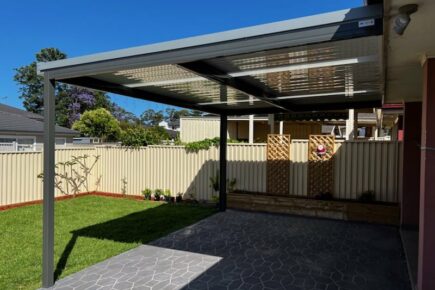 Modern backyard with pergola and lawn