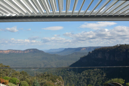 Stunning Blue Mountains landscape with sky and clouds.