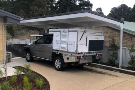 canteliver carport parked with a car