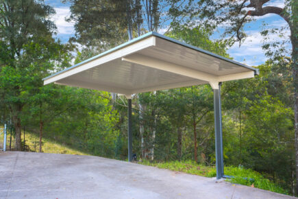 Modern carport in a lush, green setting