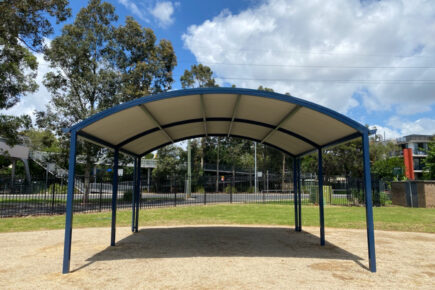 School shade with metal roof and supports.