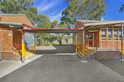 School building entrance with covered walkway.