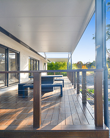 Spacious modern deck with outdoor seating area.