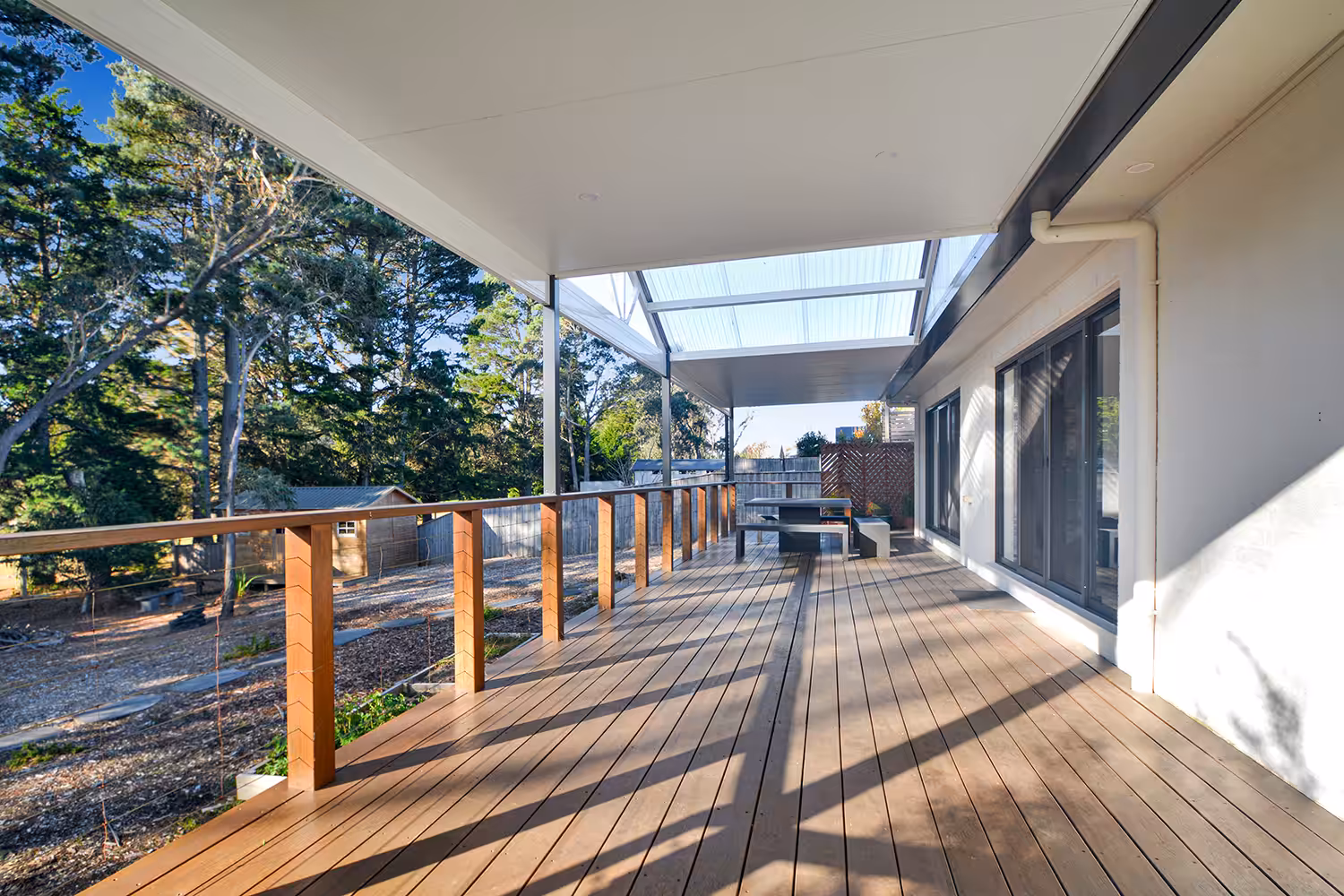 Spacious timber deck patio with garden view