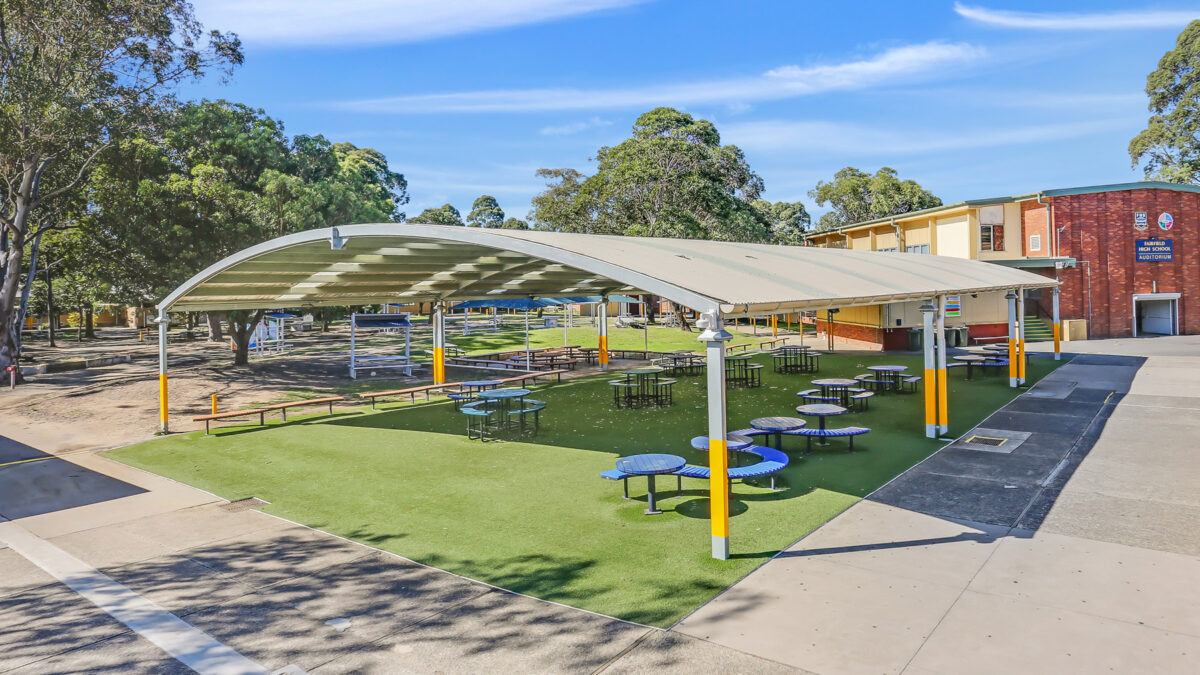 School outdoor seating area under a school cola