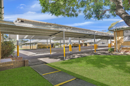 School walkway with parking lot in yellow paint