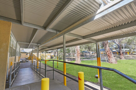 Accessible ramp with handrails at Australian school walkway