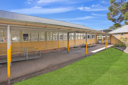 Australian school building with outdoor walkway.