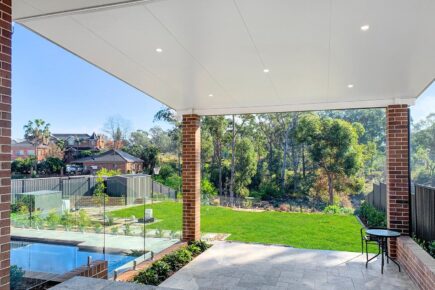 Backyard view with pool and garden from patio
