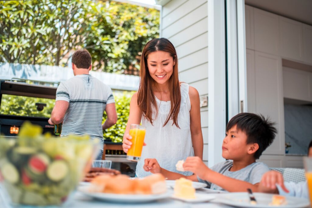 family enjoying life outdoors under their patio