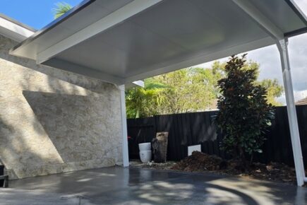 Modern cantilever carport over concrete driveway