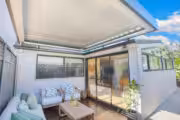 Modern opening roof with retractable awning and outdoor seating