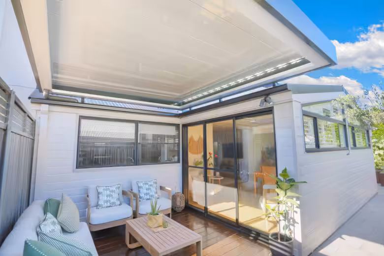Modern opening roof with retractable awning and outdoor seating